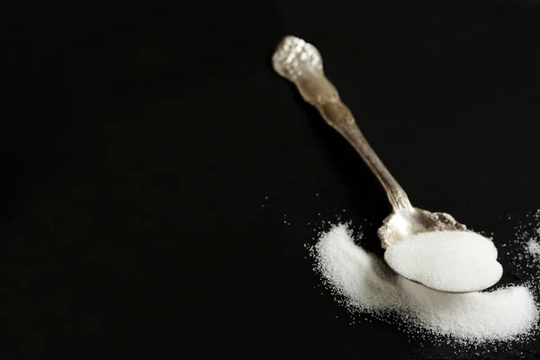 Vintage Silver Spoon of Sugar on Black Background — Stockfoto