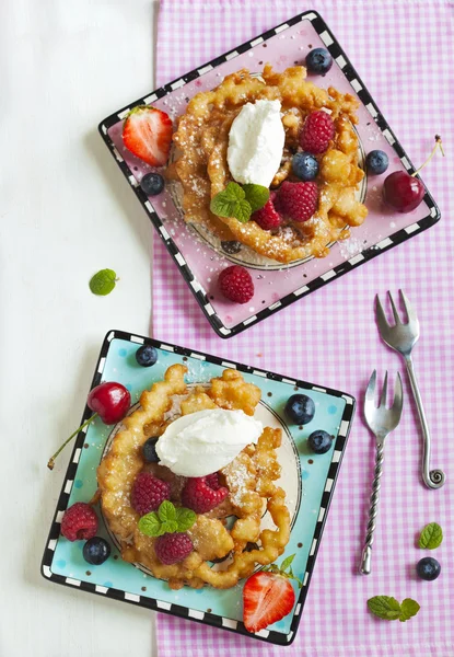 Funnel cakes with fresh berries and whipped cream — Stock Photo, Image
