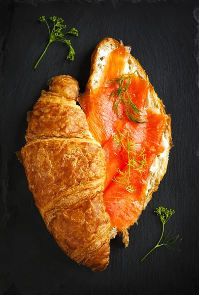 Croissant with salmon and cream cheese. Top view — Stock Photo, Image