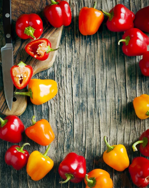 Mini Bell Peppers on wooden background with copy space. — Stock Photo, Image