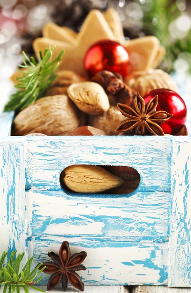 Christmas cookies, nuts and anise in wooden box. — Stock Photo, Image