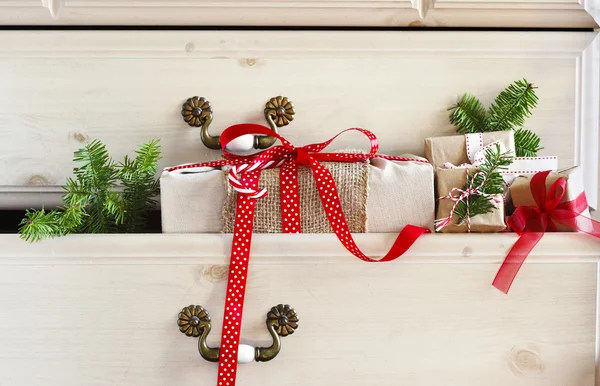 Christmas gift  in dresser drawer — Stock Photo, Image