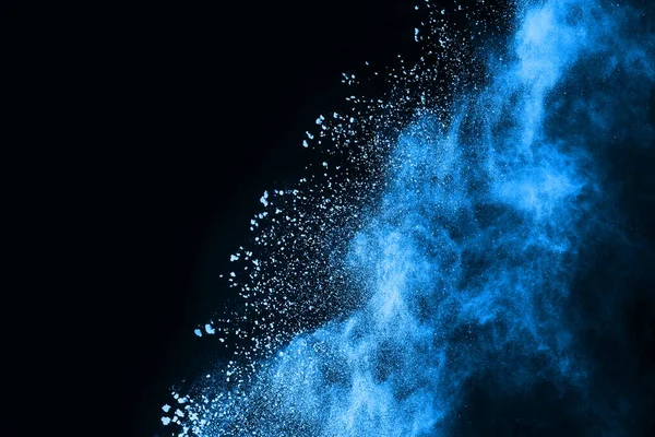 abstract blue powder splatted background,Freeze motion of color powder exploding/throwing color powder,color glitter texture on black background.