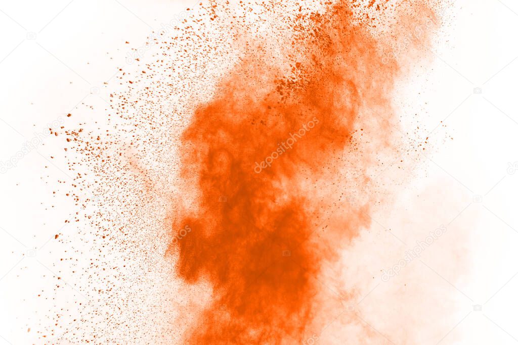 Orange powder explosion on white background. Colored cloud. Colorful dust explode. Paint Holi.