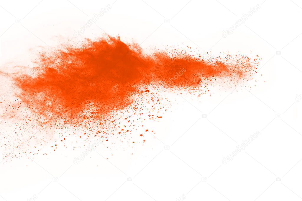 Orange powder explosion on white background. Colored cloud. Colorful dust explode. Paint Holi.