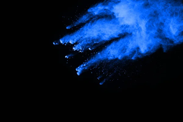 abstract blue powder splatted background,Freeze motion of color powder exploding/throwing color powder,color glitter texture on black background.