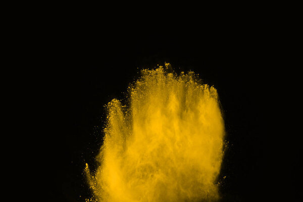 abstract orange powder splatted background,Freeze motion of color powder exploding/throwing color powder,color glitter texture on black background