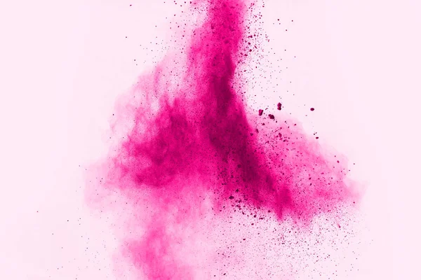 Abstract pink powder splatted background,Freeze motion of color powder exploding/throwing color powder,color glitter texture on white background.