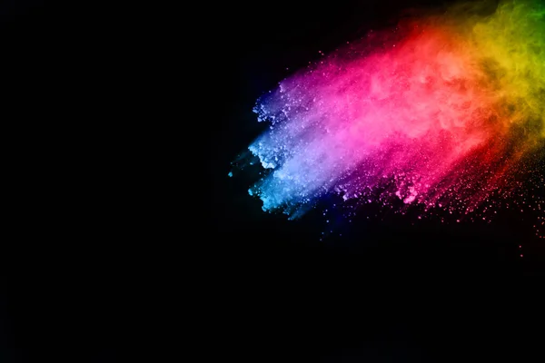 abstract colored dust explosion on a black background.abstract powder splatted background,Freeze motion of color powder exploding/throwing color powder, multicolored glitter texture.