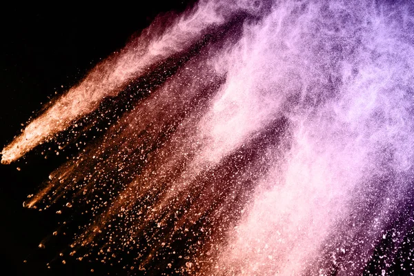 abstract colored dust explosion on a black background.abstract powder splatted background,Freeze motion of color powder exploding/throwing color powder, multicolored glitter texture.