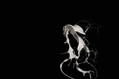 Siyah arkaplanda beyaz boya sıçraması.