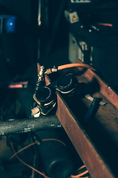 Welding goggles on iron beam — Stock Photo, Image