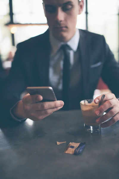 Businessman with coffee in cafe — Stock Photo, Image