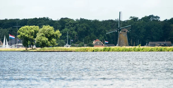 Joppe lake with windmill in summertime — Stock Photo, Image