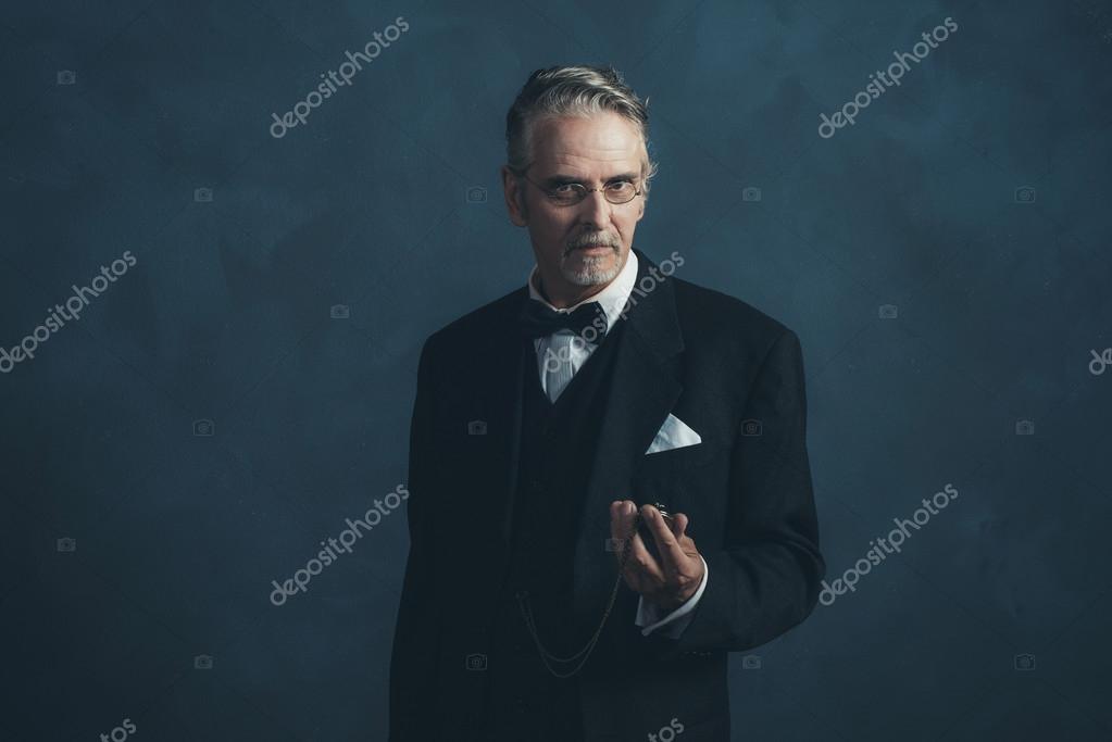 Retro 1920s businessman looking at pocket — Stock Photo