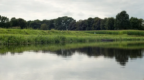 Dutch river de Berkel with small boat — Stock Photo, Image