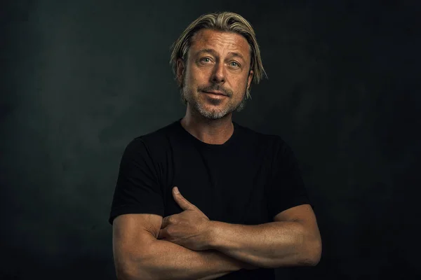 Middle Aged Tanned Blonde Man Arms Crossed Stubble Black Shirt — Stock Photo, Image