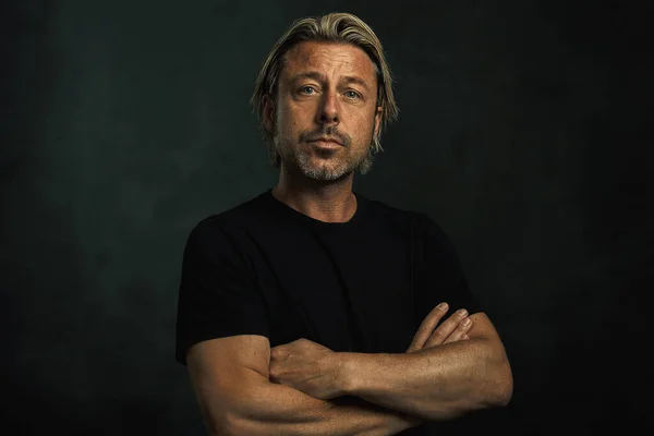 Middle Aged Tanned Blonde Man Arms Crossed Stubble Black Shirt — Stock Photo, Image