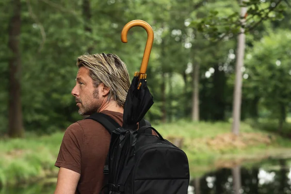 Blonde Man Stubble Beard Brown Shirt Backpack Umbrella Looking His — Stock Photo, Image