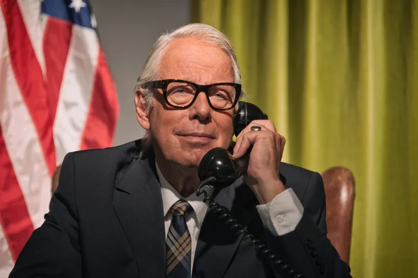 Big boss president wearing glasses calling behind desk with amer — Stock Photo, Image