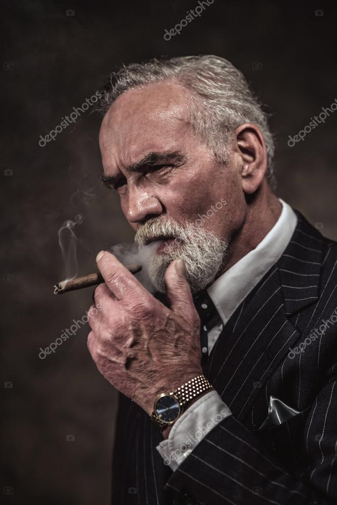 Cigar smoking characteristic senior business man with gray hair Stock Photo by Β©ysbrand 54035137 Cigar smoking characteristic senior business man with gray hair Stock Photo by Β©ysbrand 54035137