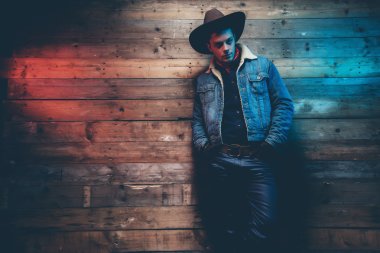 Winter cowboy jeans fashion man. Wearing brown hat, jeans jacket clipart
