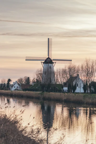 Windmill reflected in a canal — Stock Photo, Image