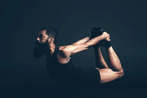 Man Doing Dhanurasana Bow Pose — Stock Photo, Image