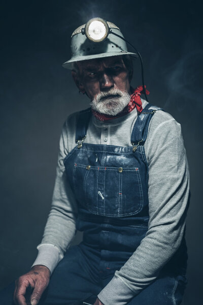 Thoughtful Senior Male Miner