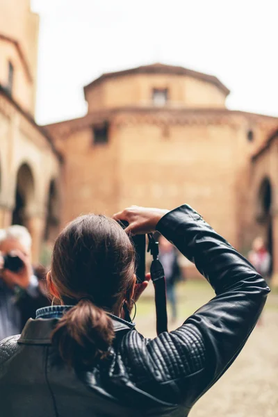 Woman tourist taking photographs