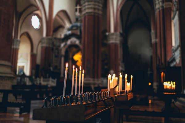 Rows of burning spiritual candles