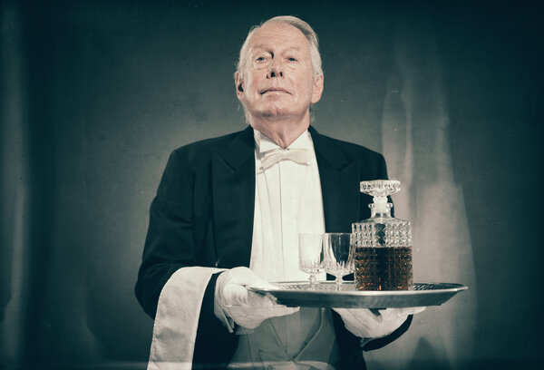 Professional Looking Senior Male Butler Wearing