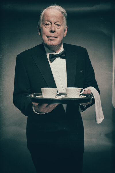 Senior Male Butler Wearing Suit