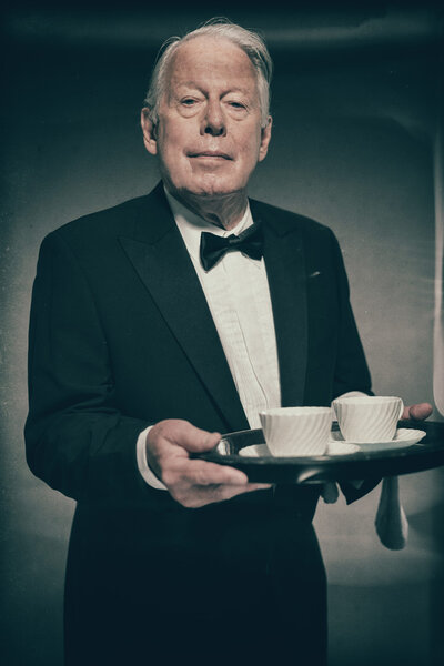 Senior Male Butler Wearing Suit