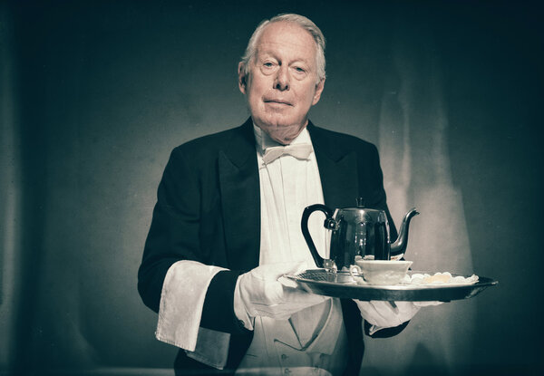 Senior Male Butler Wearing Tuxedo