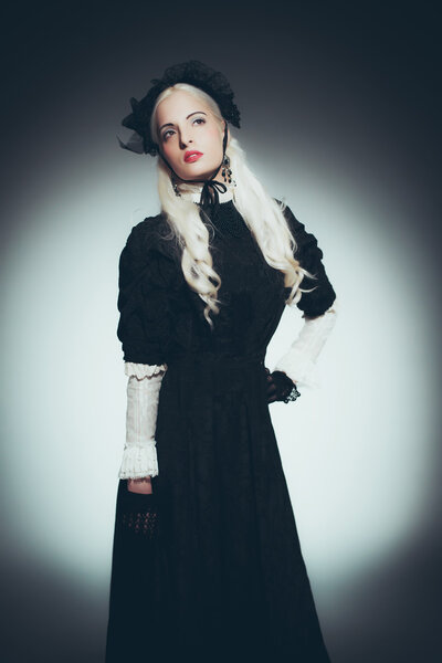 Woman with White Hair in Black Gown