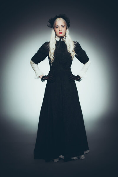 Woman with White Hair in Black Gown