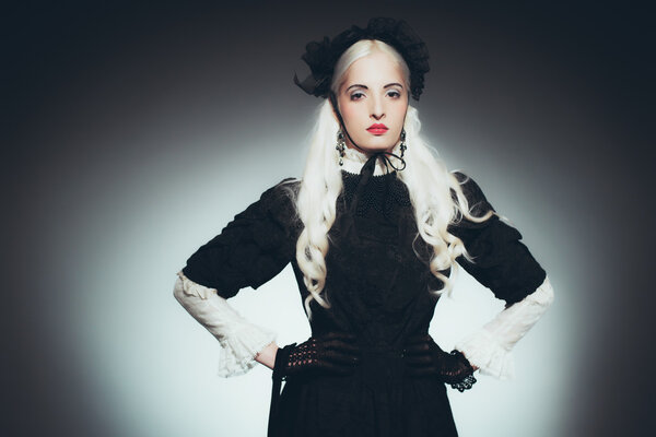 Woman with Hand Bag in Black Gown