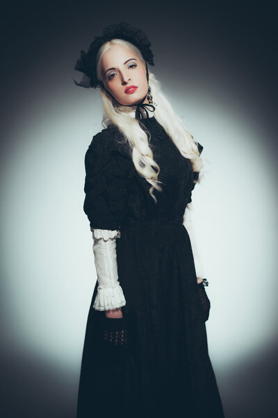 Woman with White Hair in Black Gown