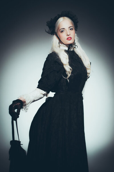 Woman in Gown Holding Hand Bag