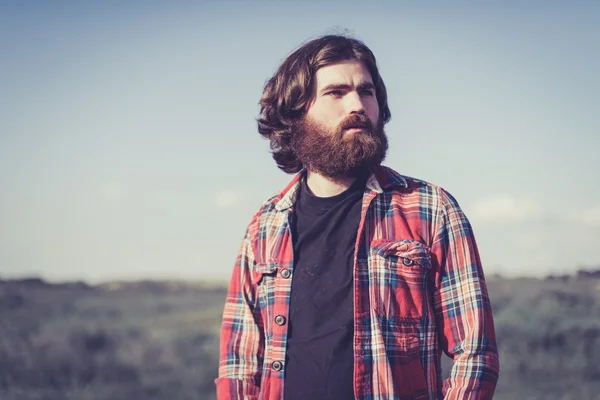 Handsome bearded man outdoors in nature — Stock Photo, Image