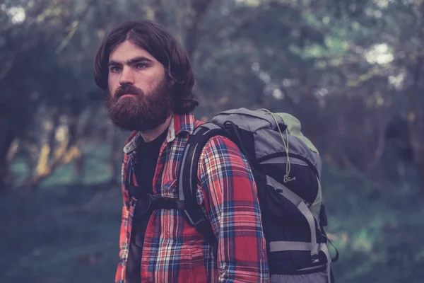 Handsome bearded male backpacker