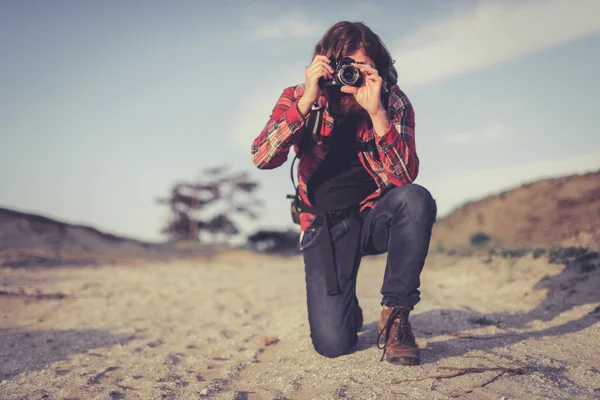 Photographer taking a photo of the camera — Stockfoto