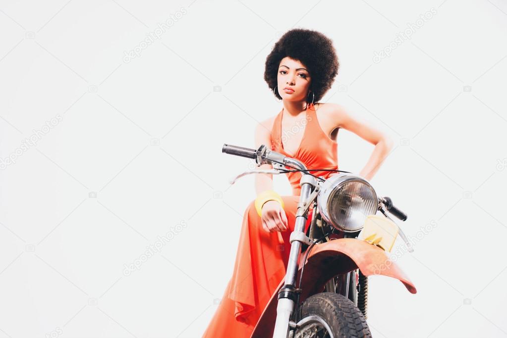 Glamorous woman on a motorbike