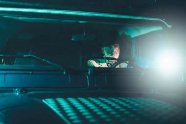 Matured Guy Driving a Vehicle at Night