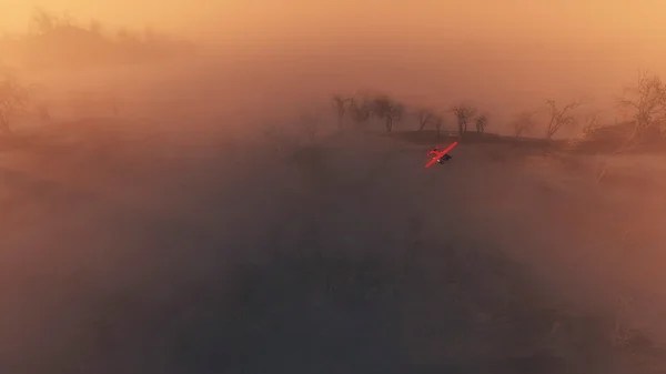 Rotes Flugzeug fliegt über neblige Landschaft — Stockfoto