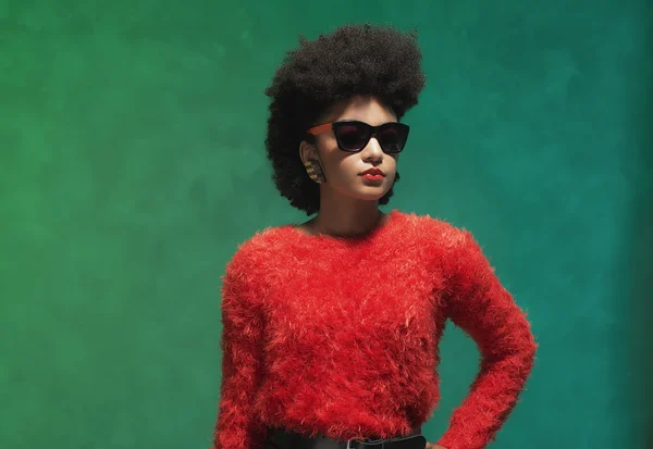 Woman in fuzzy red tops with sunglasses, — 图库照片