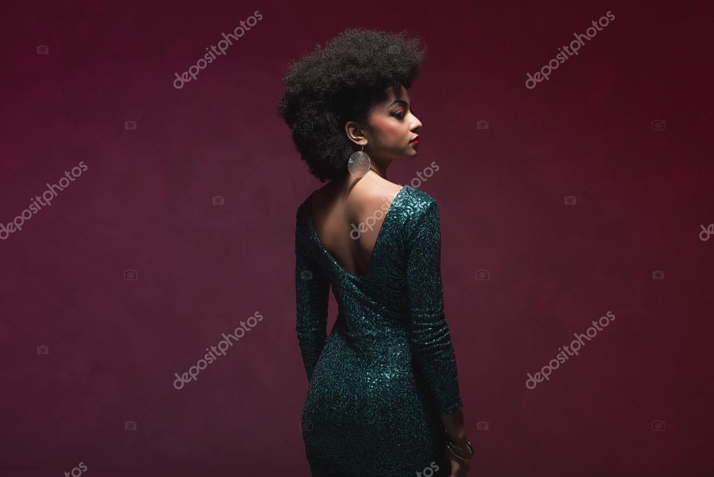 Threequarter rear view shot of a young woman Stock Photo by ©ysbrand