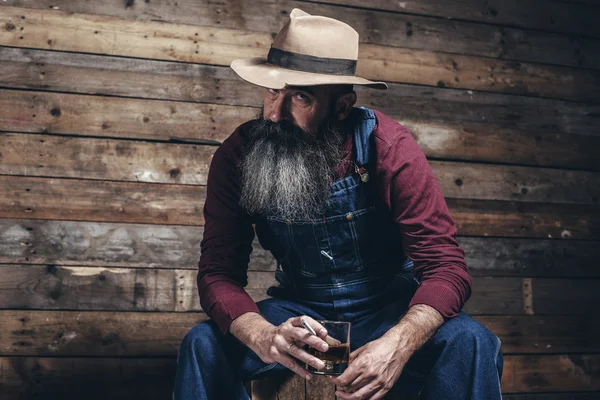 Vintage worker man with long gray beard — Stock Photo, Image