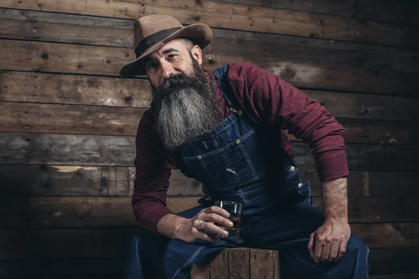 Worker man with long gray beard